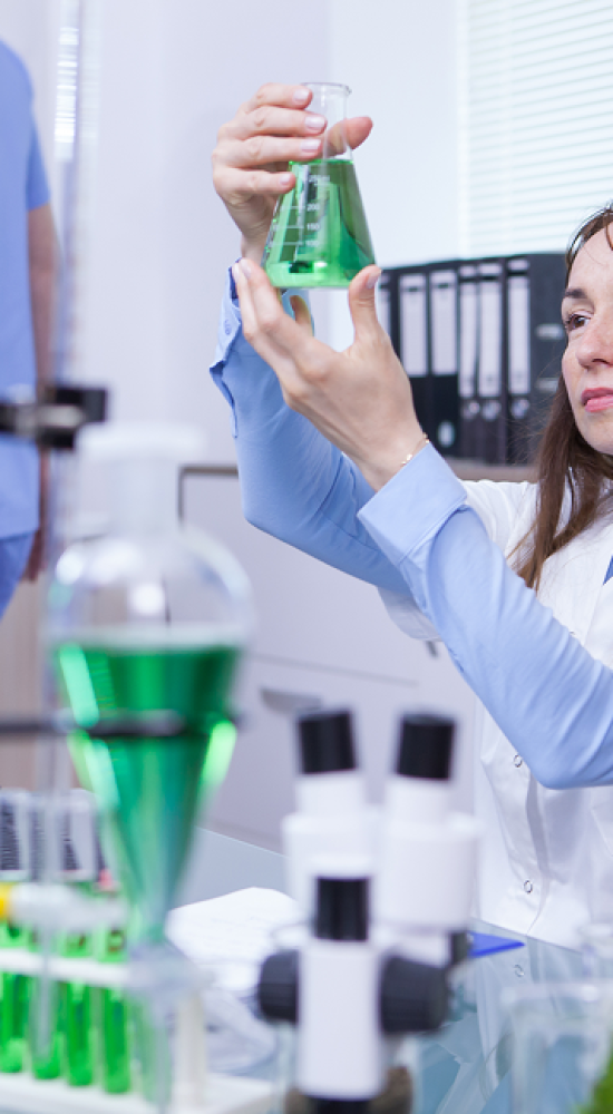 mature-female-scientist-making-scientific-test-her-research-lab-chemical-test-tubes 2